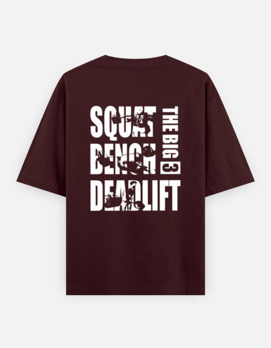 Unisex oversized burgundy t-shirt with 'The Big 3' Squat, Bench, Deadlift graphic print on the back.